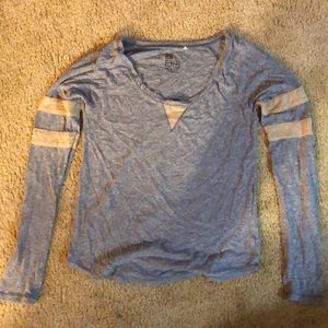 Blue and tan long sleeve shirt.